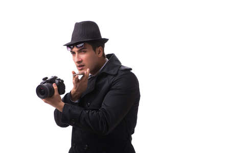 Spy with camera taking pictures isolated on whiteの写真素材