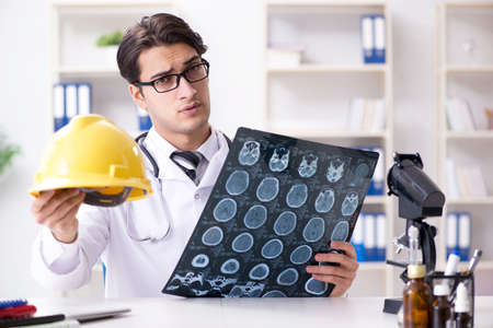 Safety doctor advising about wearing hard hat