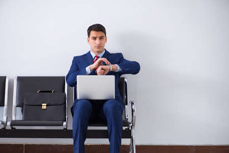 Man wairing to boarding in airport lounge roomの写真素材