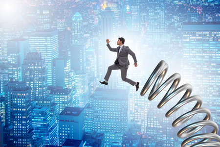 Businessman jumping from spring in promotion concept