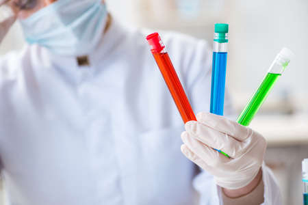 Woman chemist working in hospital clinic lab