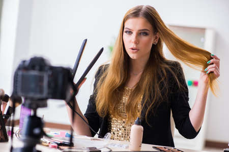 Beauty blogger filing video for her blog or vlog
