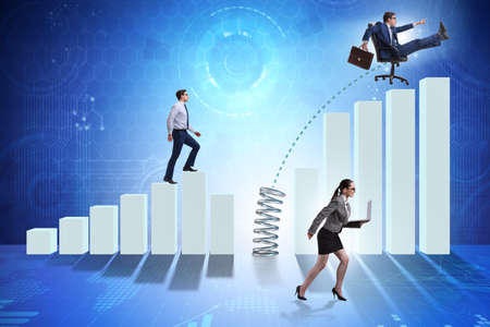 Business people jumping over bar charts