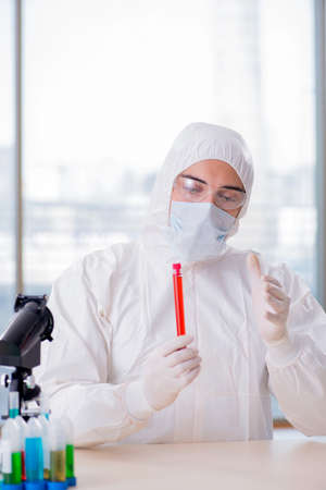 Man doctor checking blood samples in labの写真素材