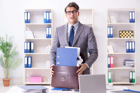 Employee with too much work taking it homeの写真素材