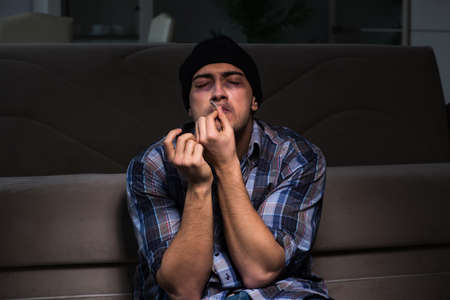 Young man in agony having problems with narcotics