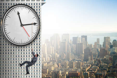 Businessman in time management conceptの写真素材