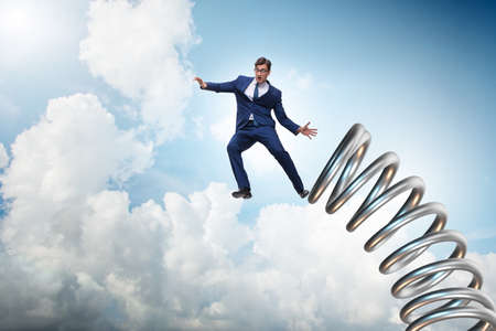 Businessman jumping from spring in promotion concept