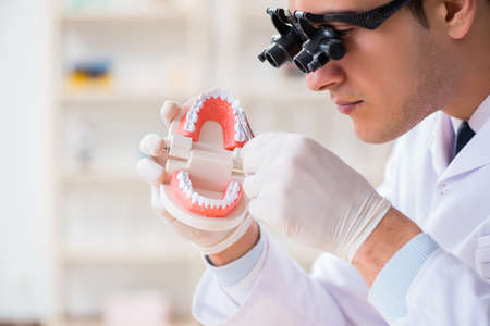 Young dentist working in the dentistry hospitalの写真素材