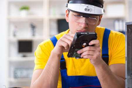 Hard drive repair and data recovery specialist working in labの写真素材
