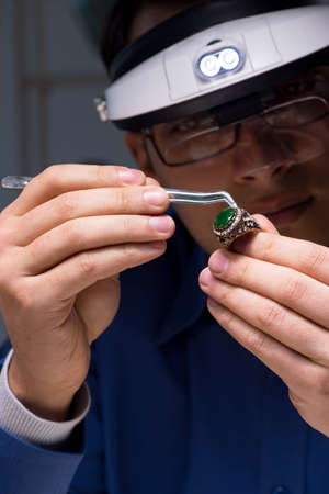 Jeweler working in his workshop late at night