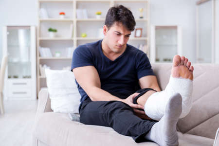 Man with broken leg recovering at home
