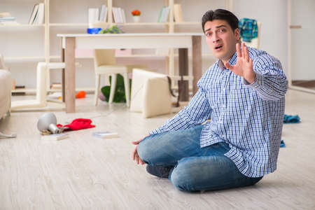Man found his house after burglary robbed by burglarsの写真素材