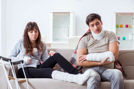 Injured family of wife and husband recovering at homeの写真素材