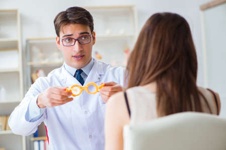Ophthalmologist is checking up patient in eye doctor hospitalの写真素材