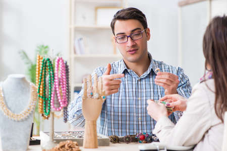 Woman visiting jeweler for jewelery evaluationの写真素材