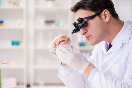 Young dentist working in the dentistry hospital