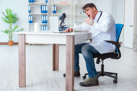 Tired doctor after night shiftの写真素材