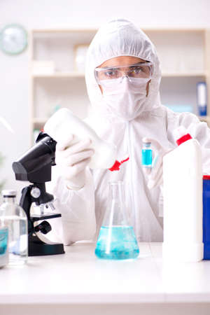 Chemist checking the quality of bathroom suppliesの写真素材
