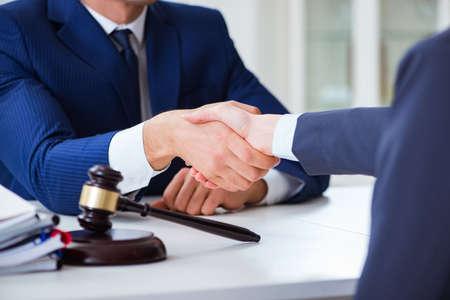 Lawyer talking to his client in officeの写真素材
