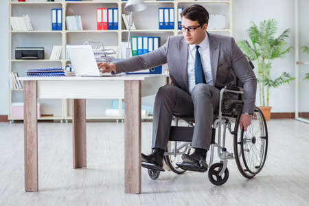 Disabled businessman working in the officeの写真素材