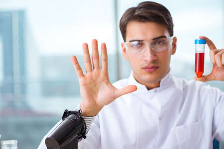 Man doctor checking blood samples in labの写真素材