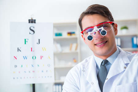 Eye doctor in eyecare concept in hospitalの写真素材