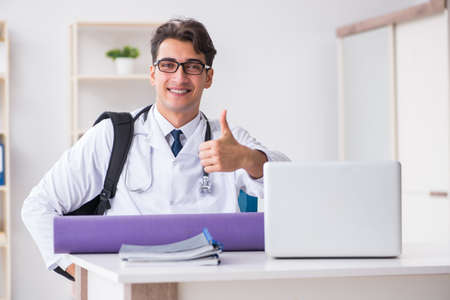 Doctor going to gym during lunch breakの写真素材