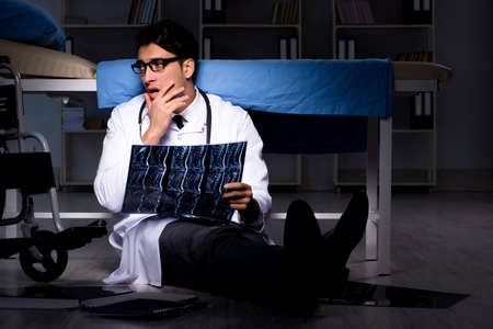Doctor working night shift in hospital after long hours
