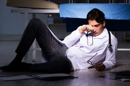 Doctor working night shift in hospital after long hours
