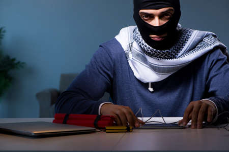 Terrorist bomber preparing dynamite bombの写真素材