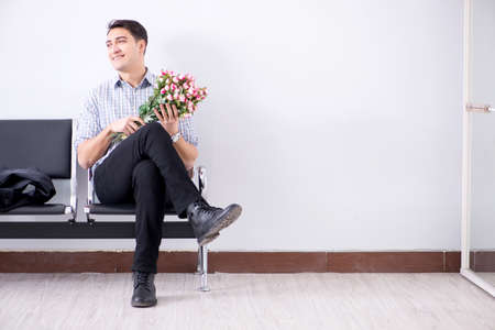 Happy dad waiting for news in maternity houseの写真素材