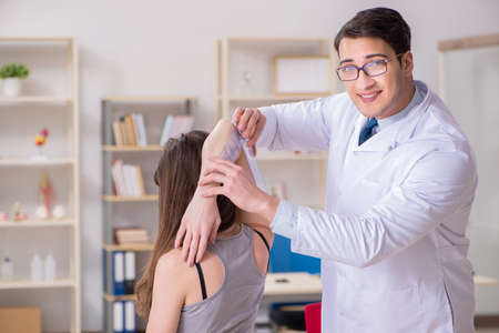 Doctor checking patients joint flexibilityの写真素材