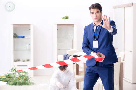 Forensics investigator at the scene of office crimeの写真素材
