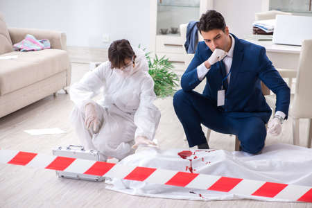 Forensics investigator at the scene of office crimeの写真素材