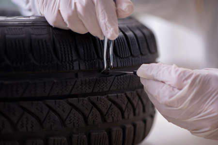 Expert is looking at car accident evidenceの写真素材