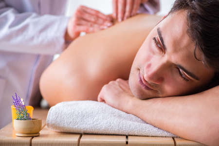 Man in spa enjoying his timeの写真素材