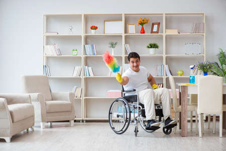 Disabled cleaner doing chores at homeの写真素材