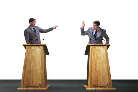Two businessmen having heated discussion at panel discussionの写真素材