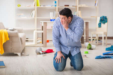 Man found his house after burglary robbed by burglarsの写真素材