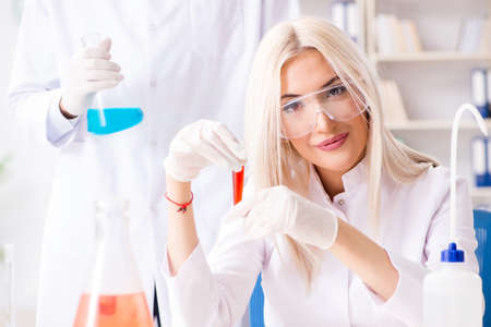 Young female woman doctor in hospital clinic labの写真素材