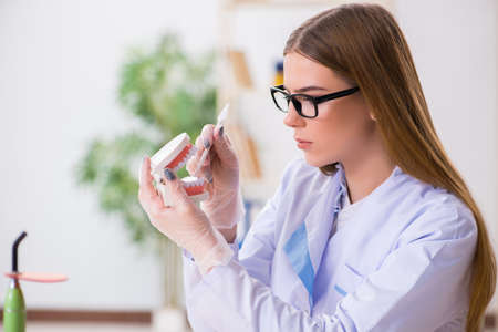 Dentistry student practicing skills in classroom