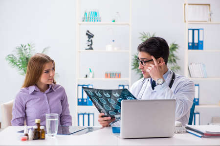 Doctor examining x-ray images of patient