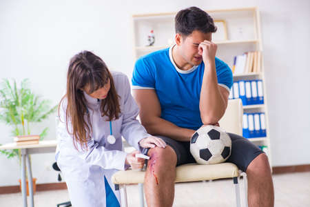 Football soccer player visiting doctor after injuryの写真素材