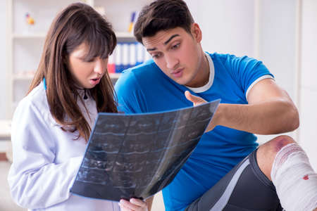 Sports player visiting doctor after injury
