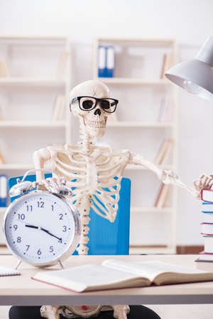 Skeleton businessman working in the office