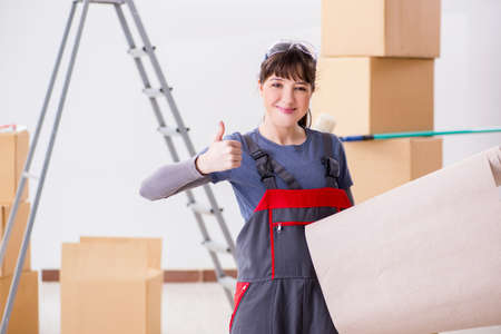 Woman preparing for wallpaper workの写真素材