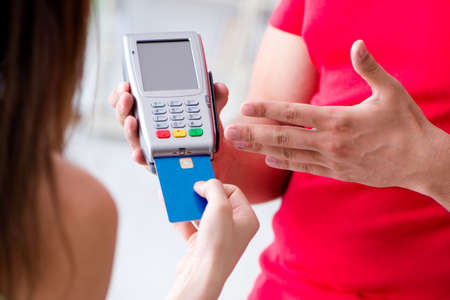 Concept of paying with POS terminalの写真素材