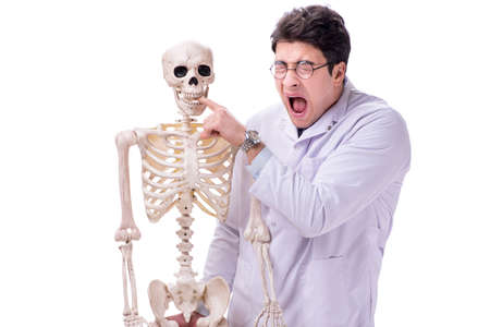 Young doctor with skeleton isolated on white