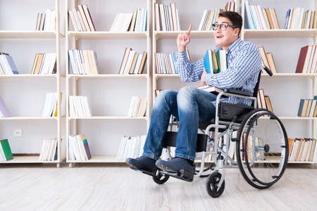 Disabled student studying in the libraryの写真素材